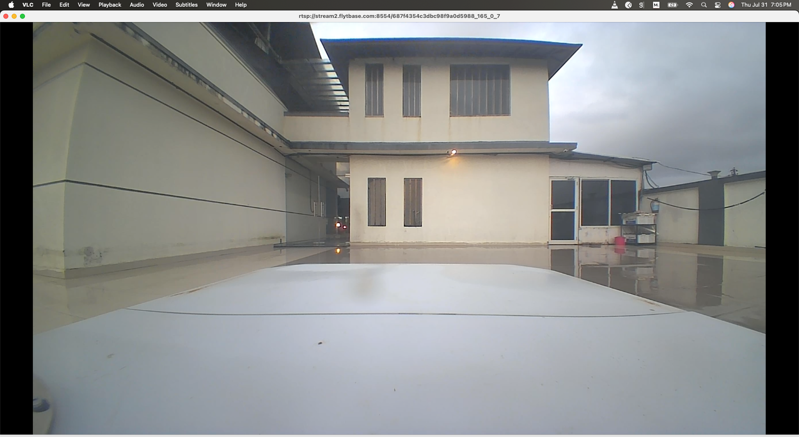 VLC Media Player showing live docking station camera feed with RTSP stream URL in title bar